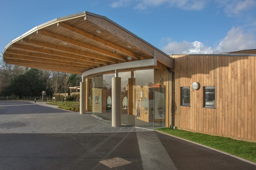 The Oaks entrance showing oak cladded walls and local flint