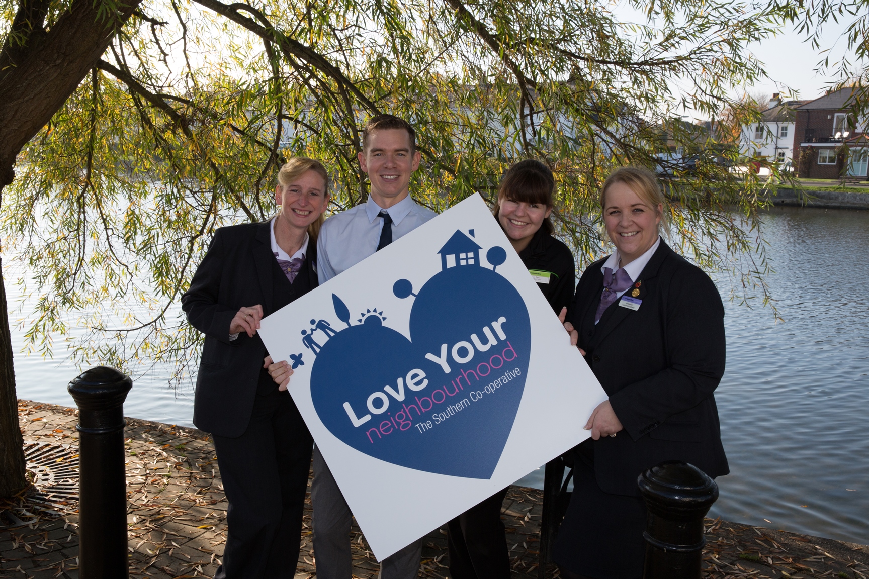 Image of The Southern Co-operative colleagues with Love Your Neighbourhood Logo